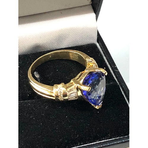 106 - Fine 18ct gold diamond and tanzanite  ring set with large central tanzanite measures approx 13mm by ... 