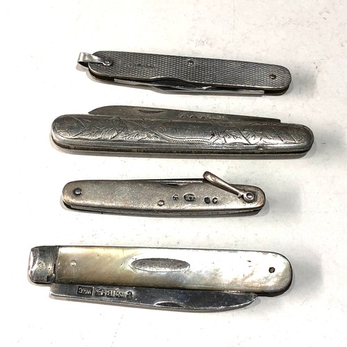 574 - 4 antique pen knives .please see images for detail as they are part of the description silver handle... 