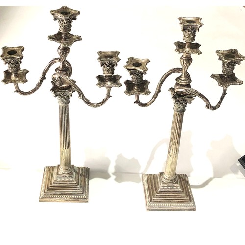 100 - Large pair of antique silver plated candleabra each measures approx height 24ins by 13ins wide age r... 