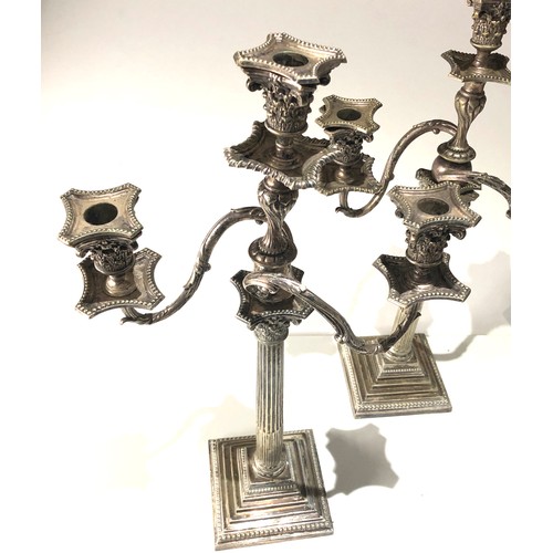 100 - Large pair of antique silver plated candleabra each measures approx height 24ins by 13ins wide age r... 