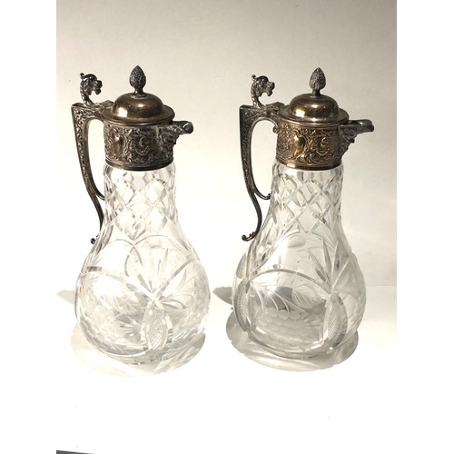 101 - Large pair of cut glass and silver pated claret jugs in good antique condition each measures approx ... 