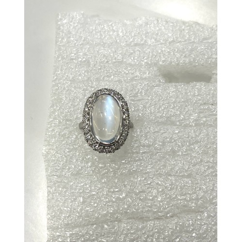 105 - Fine plat large moonstone and diamond halo ring central moonstone measures approx 18mm by 12mm with ... 