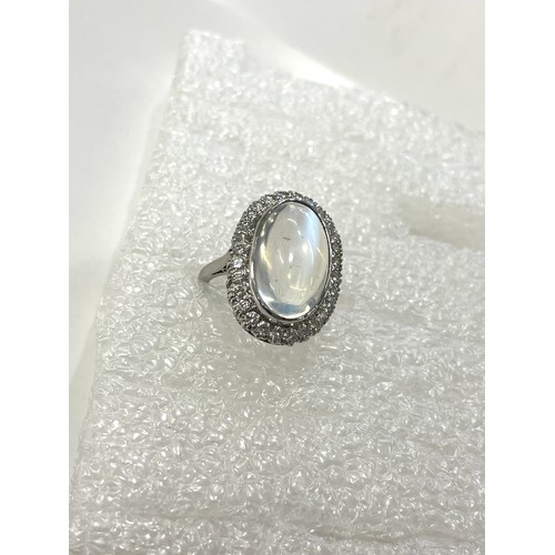 105 - Fine plat large moonstone and diamond halo ring central moonstone measures approx 18mm by 12mm with ... 