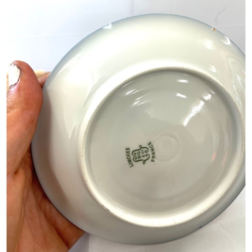 72 - Pair Limoges cup and saucers, one saucer has sustained a chip