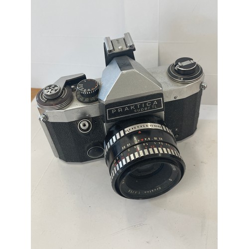 63 - Canon eos 1000f camera and a praktica super tl camera, both untested