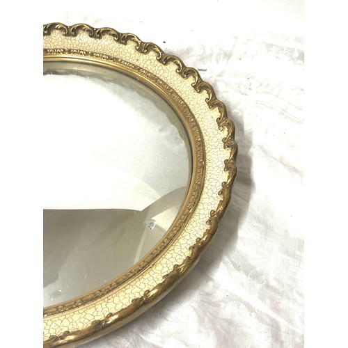 64 - Gilt framed vintage ornate circular mirror, approximate measurements: 17 inches in diameter