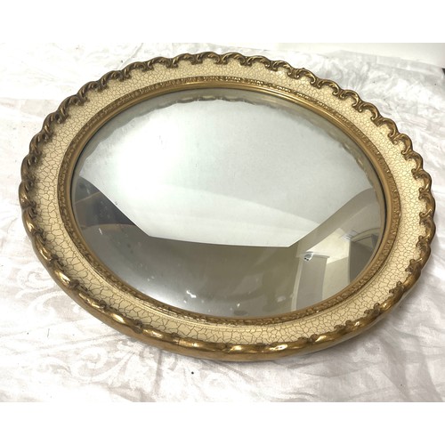 64 - Gilt framed vintage ornate circular mirror, approximate measurements: 17 inches in diameter