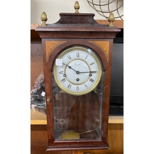 22 - Small inlaid wall clock, with pendulum and key