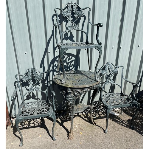 100D - Cast iron table and 3 chairs