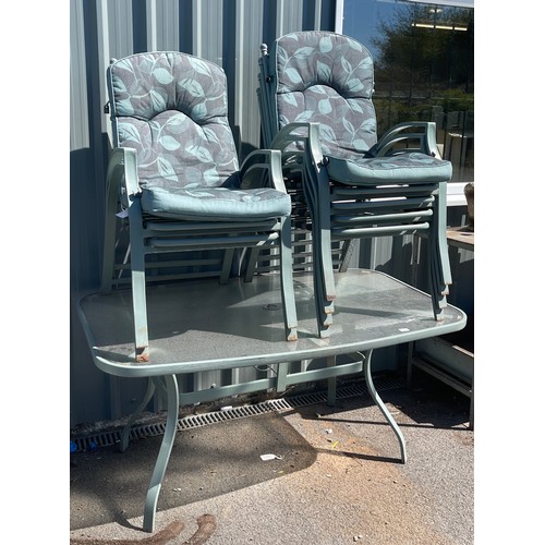 100I - Outside table and 6 chairs, seats have cushion covering