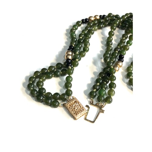 78 - 14ct gold  jade bead necklace with gold bead spacers 3 rows of jade beads weight 28.6g