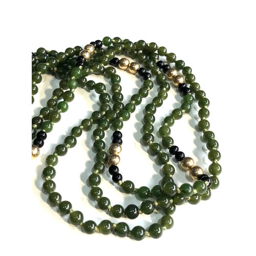 78 - 14ct gold  jade bead necklace with gold bead spacers 3 rows of jade beads weight 28.6g