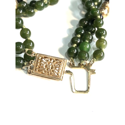 78 - 14ct gold  jade bead necklace with gold bead spacers 3 rows of jade beads weight 28.6g