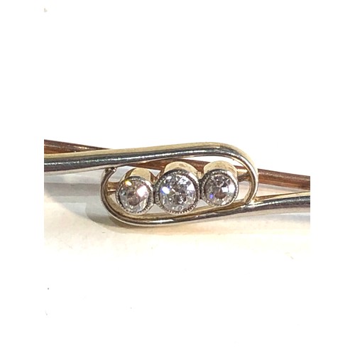 82 - Antique 18ct gold 3 stone diamond brooch measures approx 4.8cm long weight 4.1g