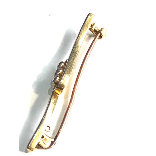 82 - Antique 18ct gold 3 stone diamond brooch measures approx 4.8cm long weight 4.1g
