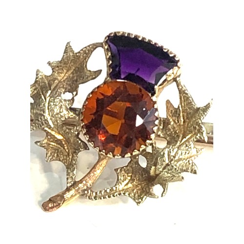 103 - Fine 18ct gold scottish thistle brooch set with amethyst and citrine stones measures approx 7cm by 2... 