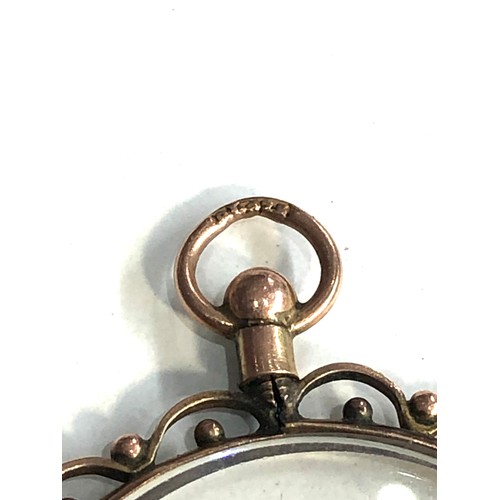 109 - Antique 9ct gold framed picture locket measures approx 4cm drop by 3.1cm wide weight 5g