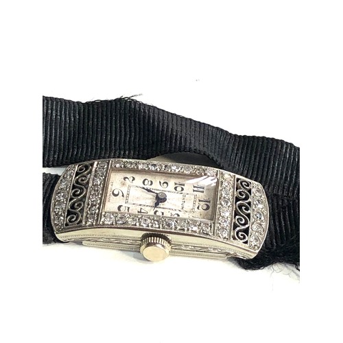 111 - 18ct white gold art deco diamond cocktail watch case measures approx 3.3cm by 1.4cm the watch is tic... 