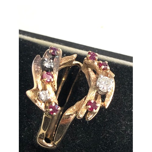 112 - 14ct gold diamond and ruby dress ring weight 6.3g
