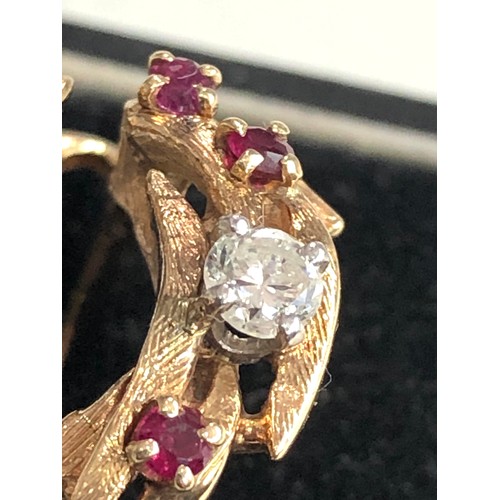 112 - 14ct gold diamond and ruby dress ring weight 6.3g