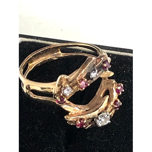 112 - 14ct gold diamond and ruby dress ring weight 6.3g