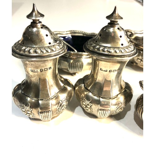 75B - Antique silver cruet set missing liners mustard pot bun feet are damaged weight 220