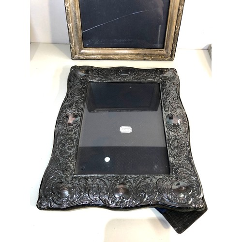 67 - 2 large silver picture frames measure approx 32cm by 24cm glass cracked and back stand come away on ... 