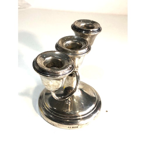 69 - Small silver candelabra measures approx 13.3cm height 9.5cm Birmingham silver hallmarks filled base