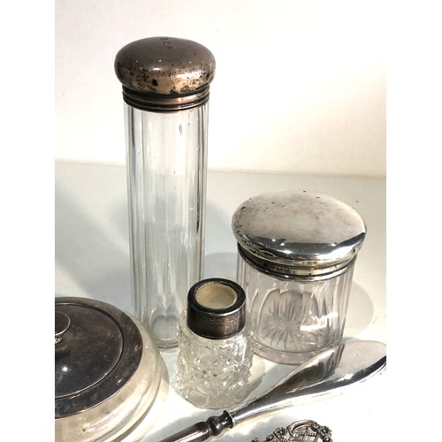 39 - Selection of silver items includes silver top dressing table bottles button hooks etc