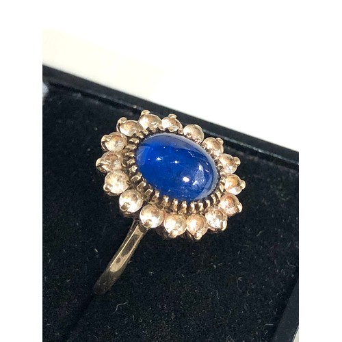 374 - 9ct gold blue stone cabochon set cocktail ring weight 3.8g