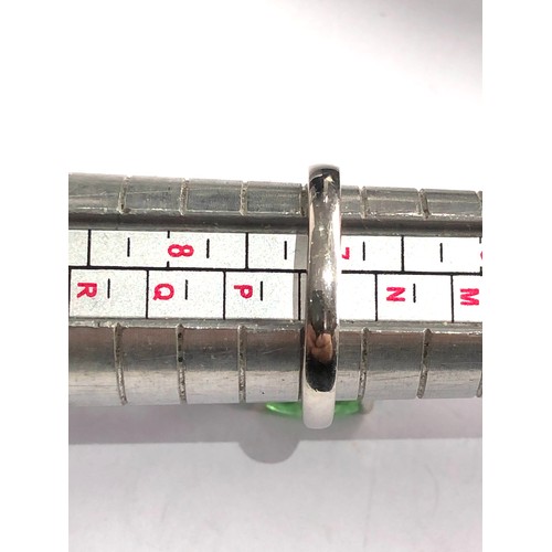 76 - 9ct white gold diamond and emerald ring large central emerald measures approx 13mm by 10mm with diam... 