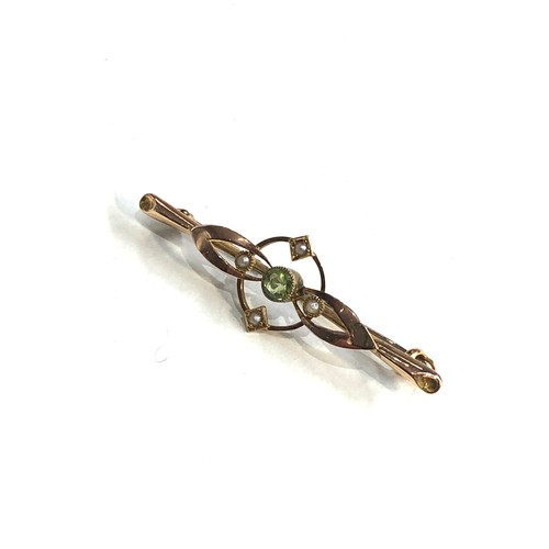 280 - Antique 15ct gold peridot and seed-pearl brooch measures approx 4.2cm by 1.3cm weight 1.7g