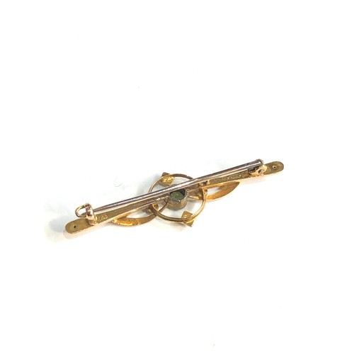 280 - Antique 15ct gold peridot and seed-pearl brooch measures approx 4.2cm by 1.3cm weight 1.7g