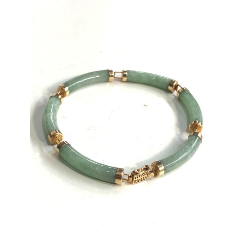 213 - 14ct gold chinese jade bracelet weight 12g