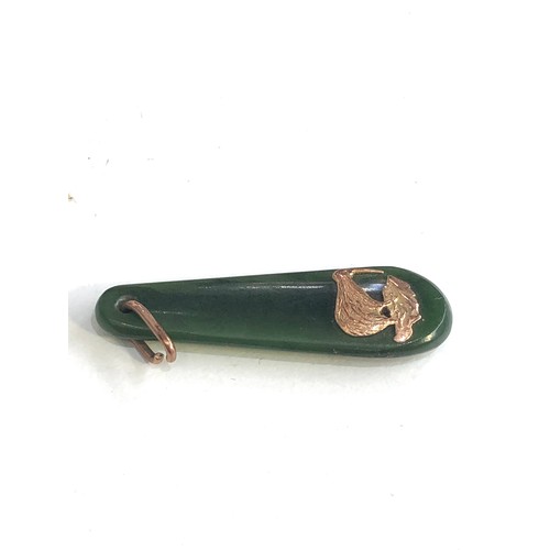 229 - 9ct gold Kiwi jade pendant measures approx 4.5cm drop by 1.3cm wide weight 4.3g