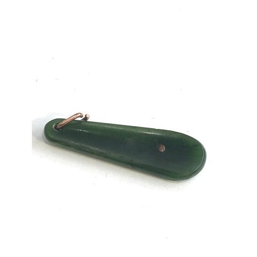 229 - 9ct gold Kiwi jade pendant measures approx 4.5cm drop by 1.3cm wide weight 4.3g