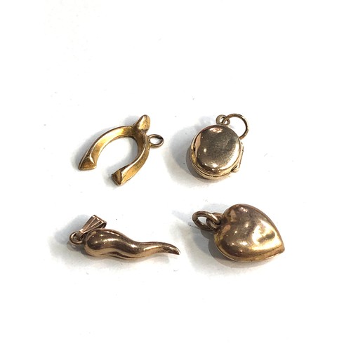 207 - 9ct gold wish bone, heart, horn of life & miniature locket charm/pendants