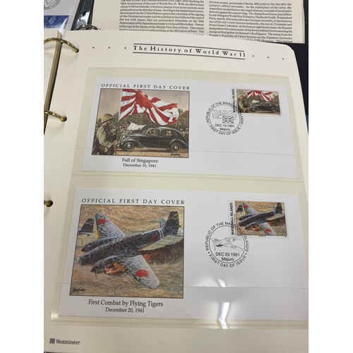 8 - 2 Albums containing Westminister mint the history of WW2 first day covers and coin sets include £2 a... 