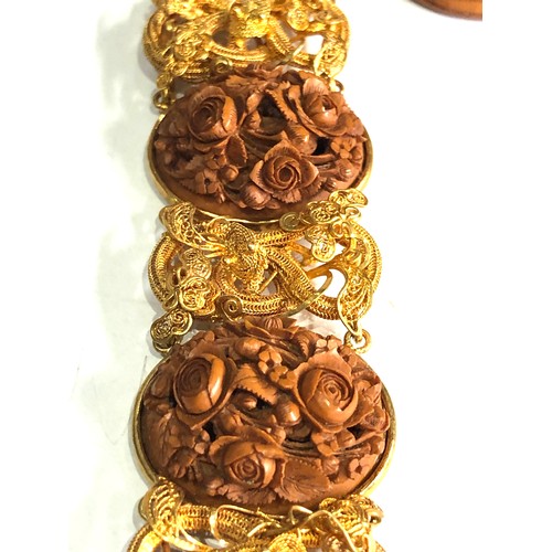 194 - Antique 18ct gold chinese hand carved walnut panel bracelet with filigree snake design, needs repair... 