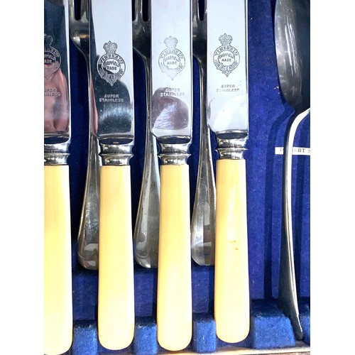 1 - Impressive vintage canteen of cutlery with ivorine handles in oak case 
Knives - 24 
Forks- 24 
Tabl... 