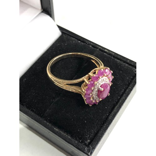 54 - 9ct gold diamond and ruby ring weight 4g