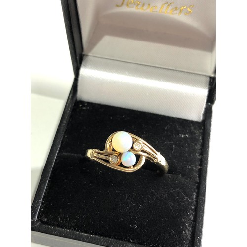 75 - 14ct gold opal ring 2.7g