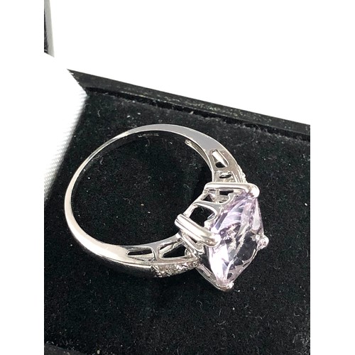 86 - 9ct gold diamond and amethyst ring weight 4.1g