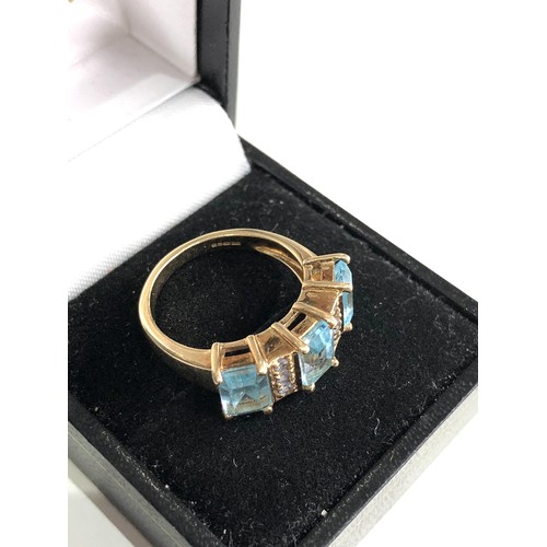 87 - 9ct gold topaz and tanzanite ring weight 4.7g