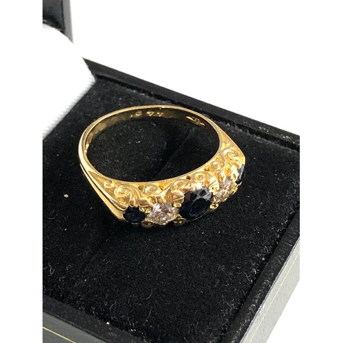 104 - 18ct gold diamond and sapphire ring weight 5.6g