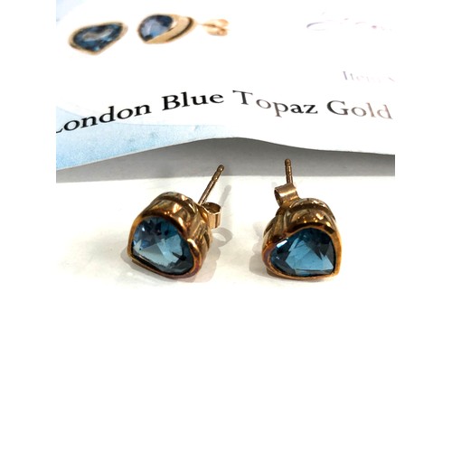 121 - Certificated 9ct gold blue topaz gold earrings