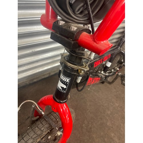 100G - Boys Hawk corkscrew BMX with stump pegs front and back