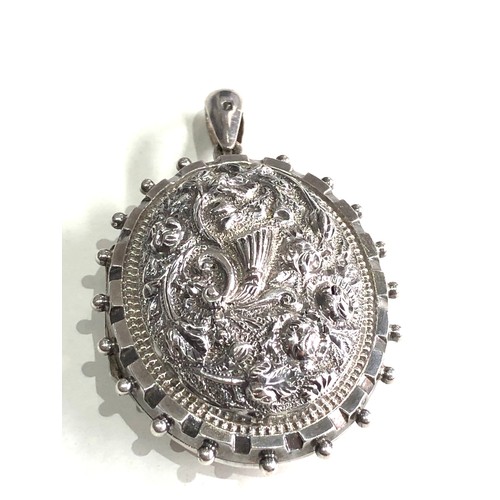 134 - Ornate victorian silver locket measures approx 5.6cm drop by 3.5cm wide