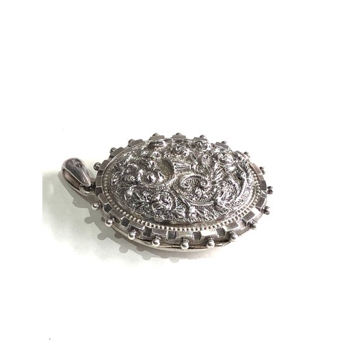 134 - Ornate victorian silver locket measures approx 5.6cm drop by 3.5cm wide