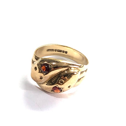 79 - 9ct gold garnet set snake ring ring weight 4.1g